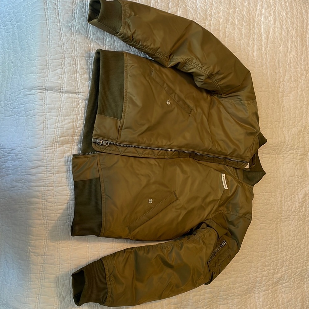NWOT Converse Jacket in Green with logo on front and back of jacket.